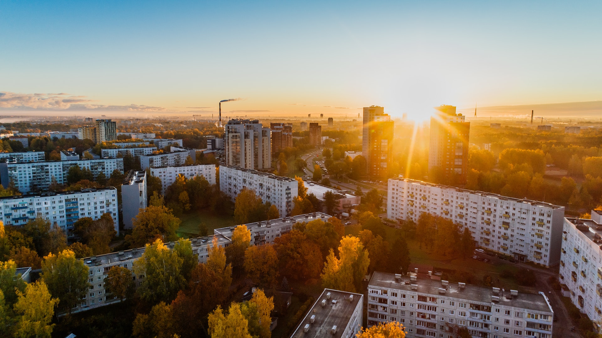BOMA BEST - An aerial view of a city at sunset, showcasing its beautiful Launch  during the evening hours.